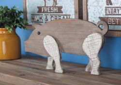 Brown and white pig sculpture